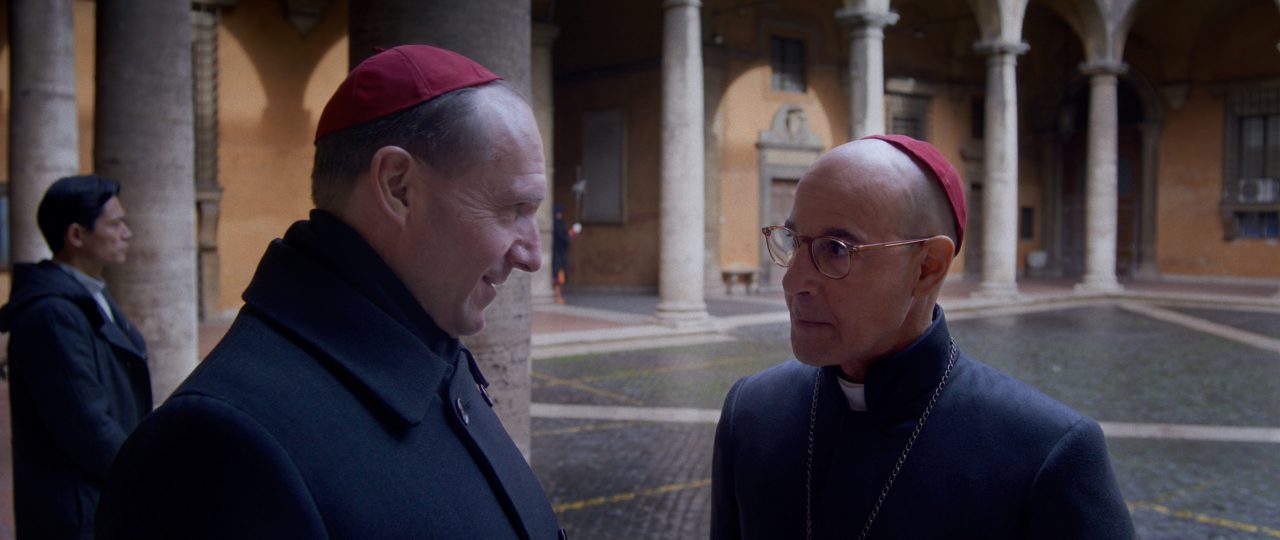 (L to R) Ralph Fiennes as Cardinal Lawrence and Stanley Tucci as Cardinal Bellini in director Edward Berger's CONCLAVE, a Focus Features release. Credit: Courtesy of Focus Features. © 2024 All Rights Reserved.