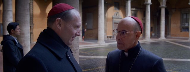 (L to R) Ralph Fiennes as Cardinal Lawrence and Stanley Tucci as Cardinal Bellini in director Edward Berger's CONCLAVE, a Focus Features release. Credit: Courtesy of Focus Features. © 2024 All Rights Reserved.